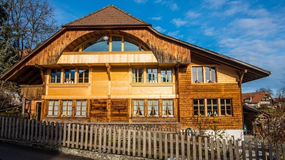 Stately, multi-story wood cottage.