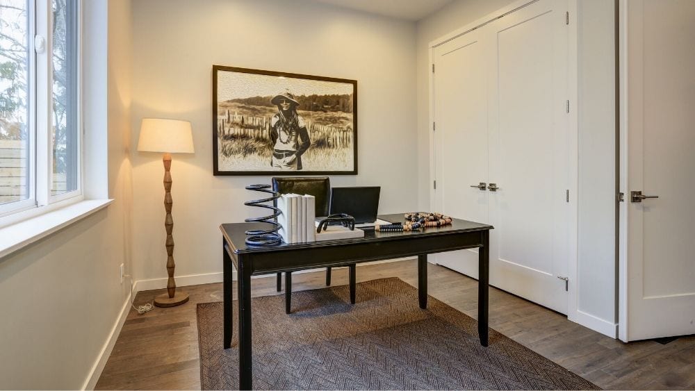 Home office in a corner of a room utilizing the space efficiently