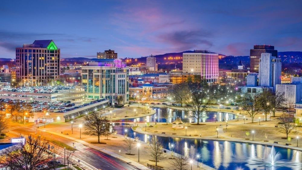 A colorful modern city with parks, waterways, and lots of buildings.