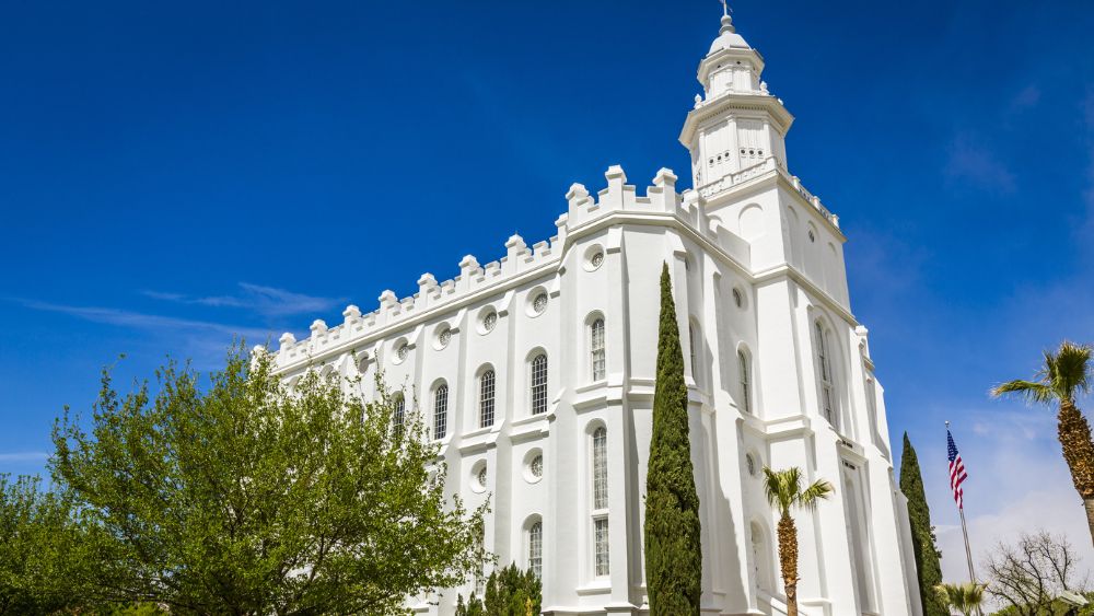  white, ornate church with trees 