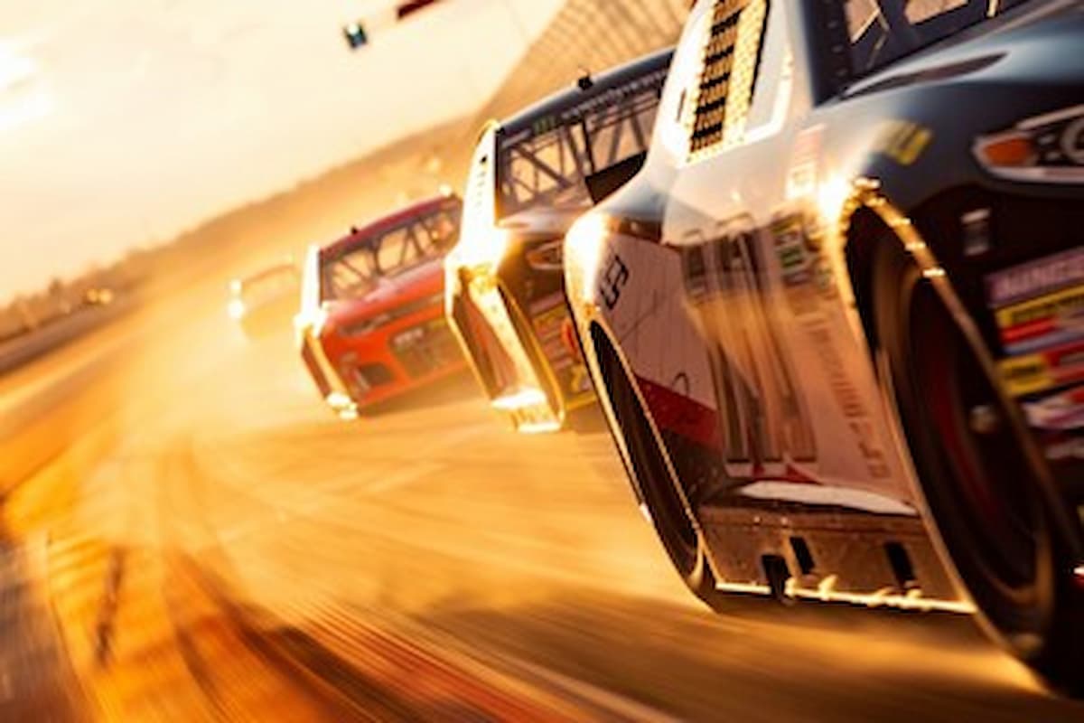 close up of cars racing on Talladega Speedway