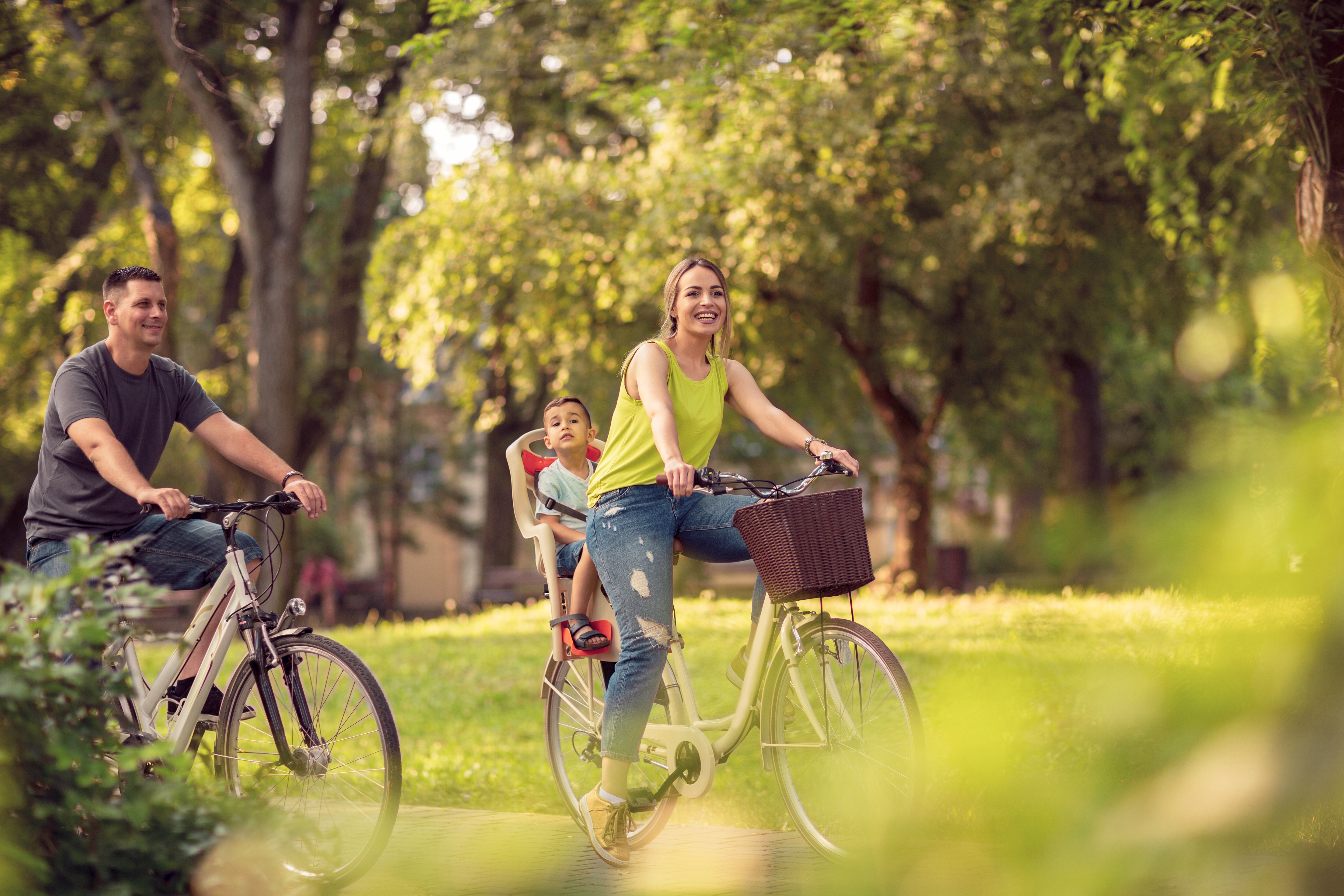 Suburban family on bikes
