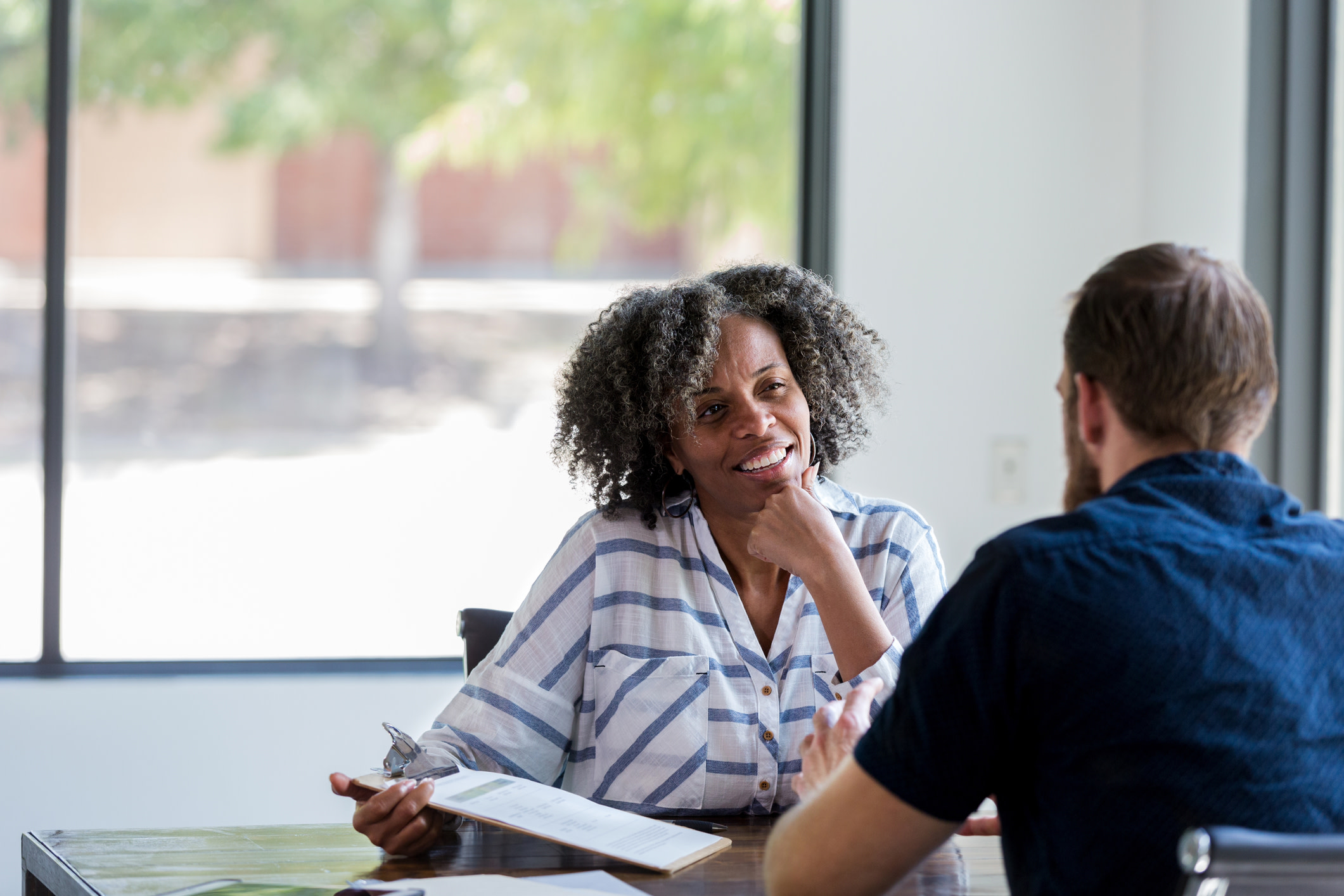 A man and woman in a mentoring session.