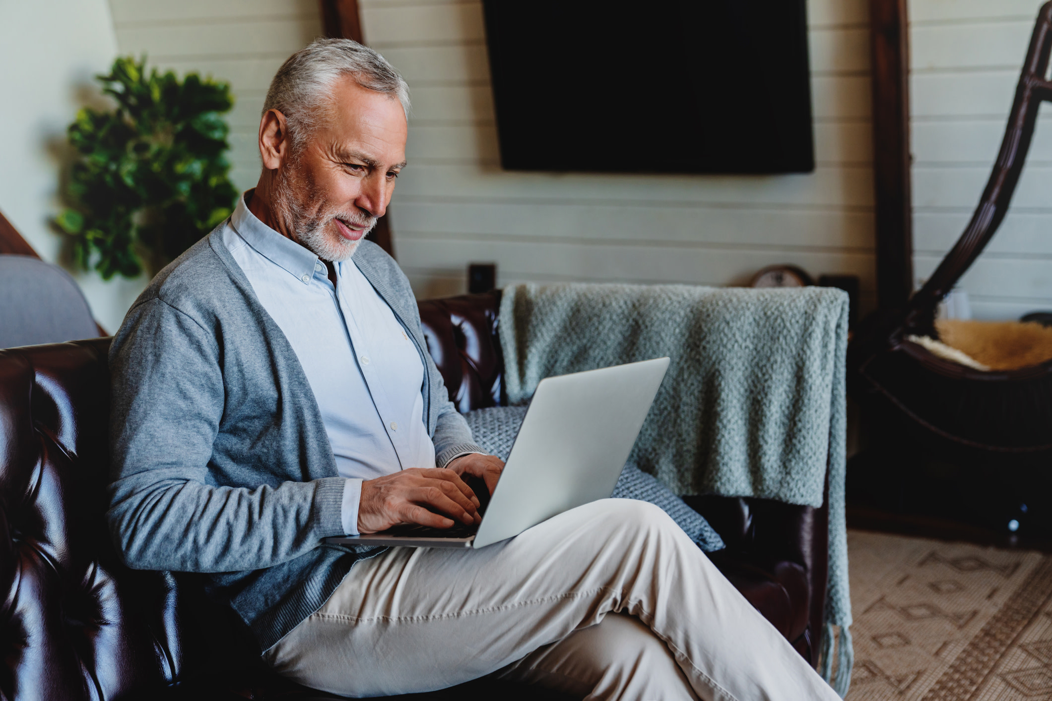 A middle-aged man in front of a computer.