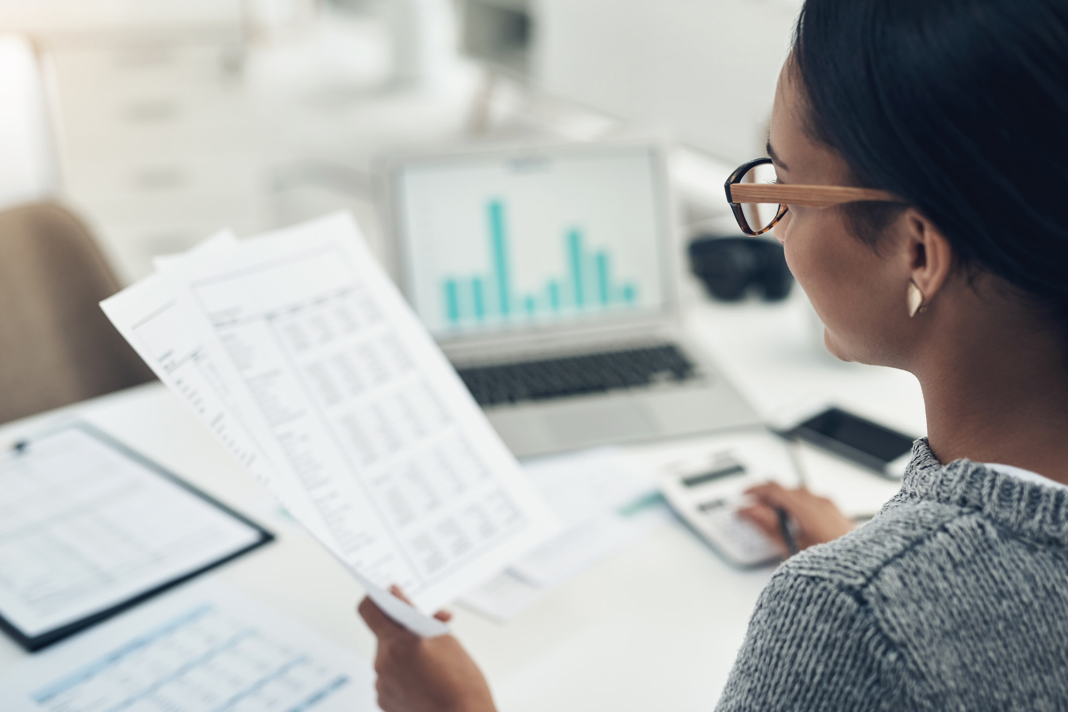 Woman looking at reports.