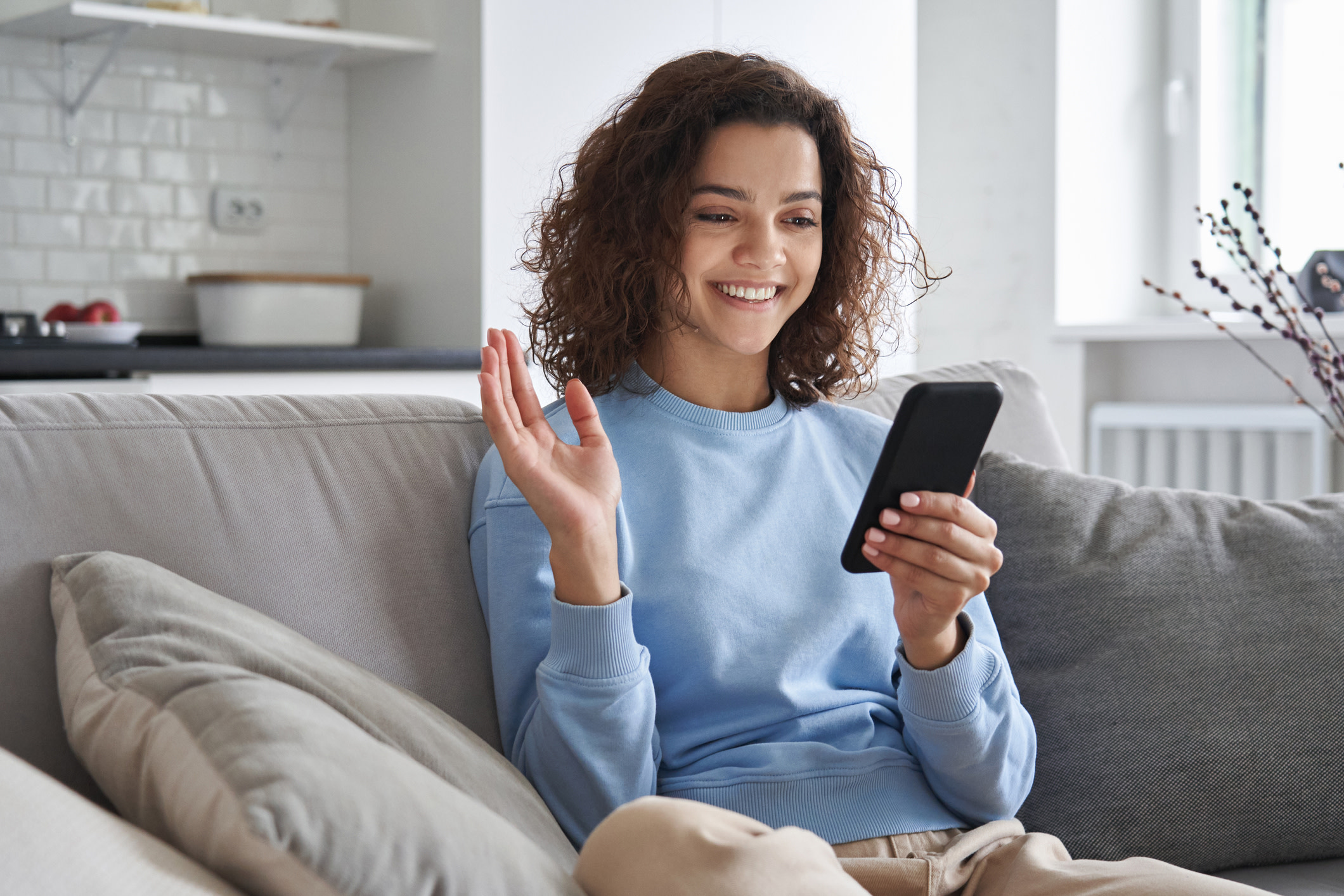 A woman smiling on Facetime. 