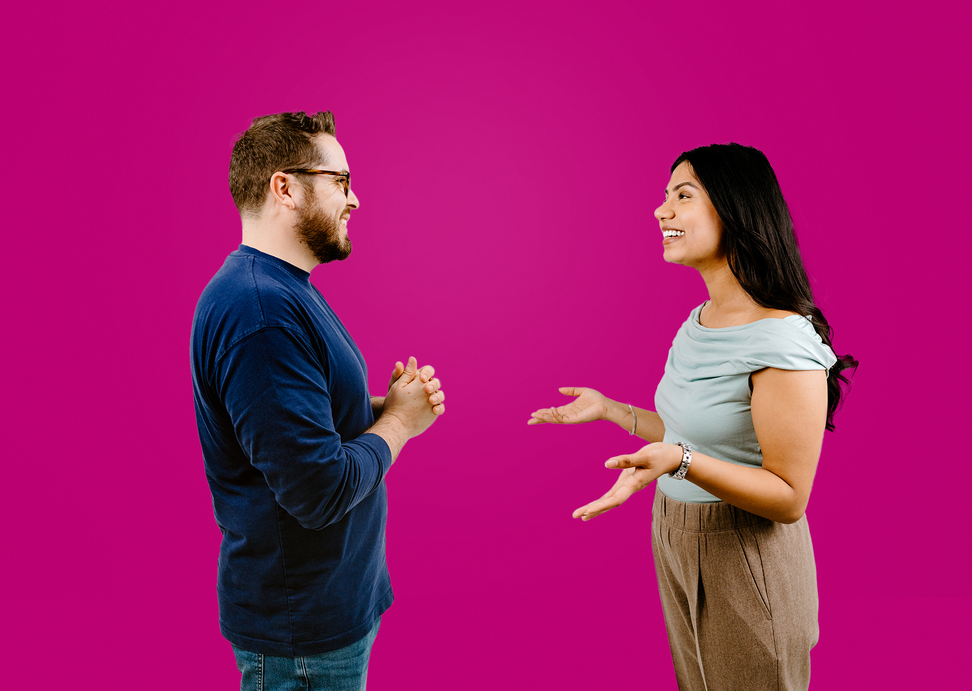 Man in dark blue top chatting one to one with woman in light blue shirt