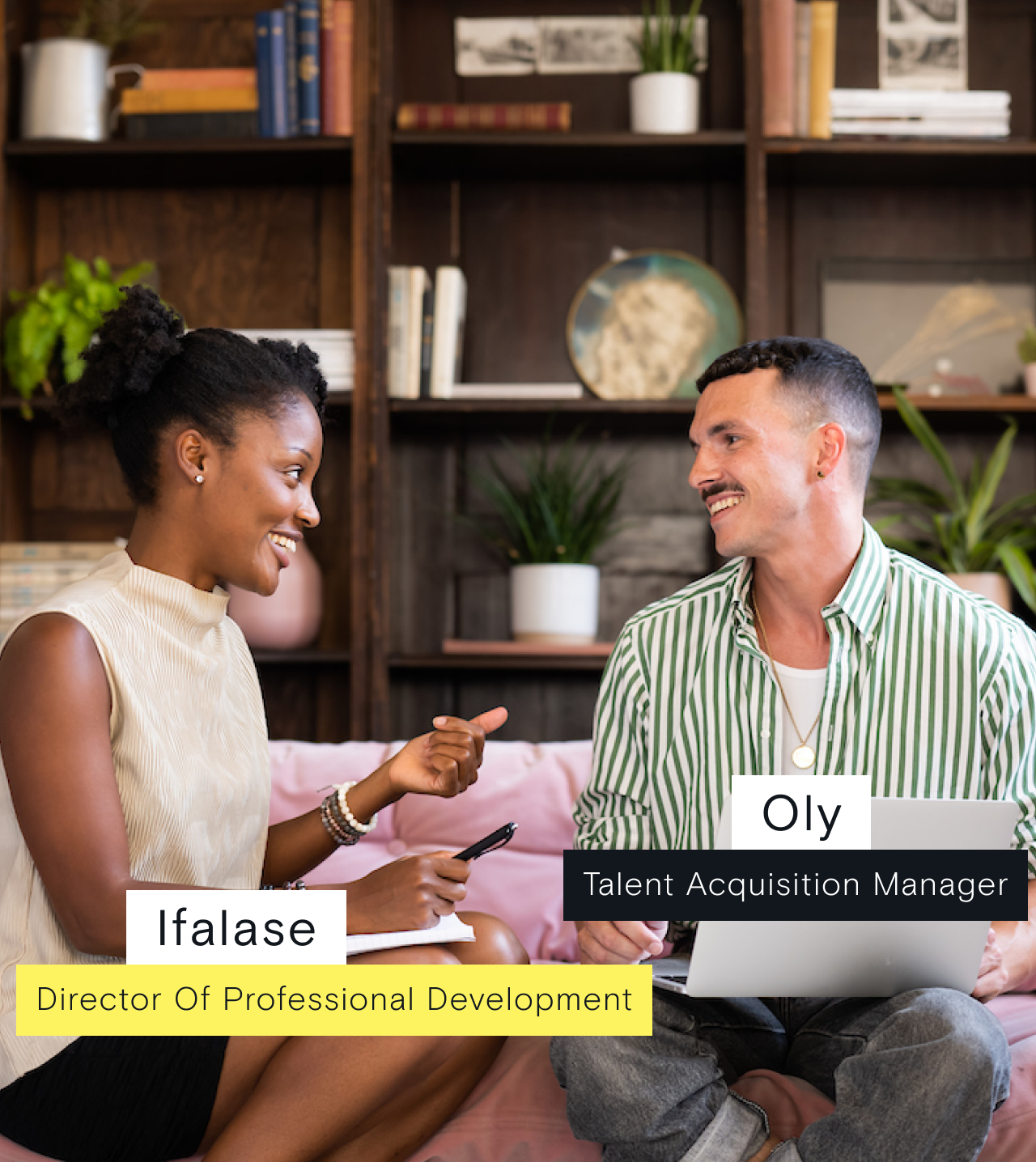 Two colleagues, Ifalase and Oly, chatting on a pink sofa.