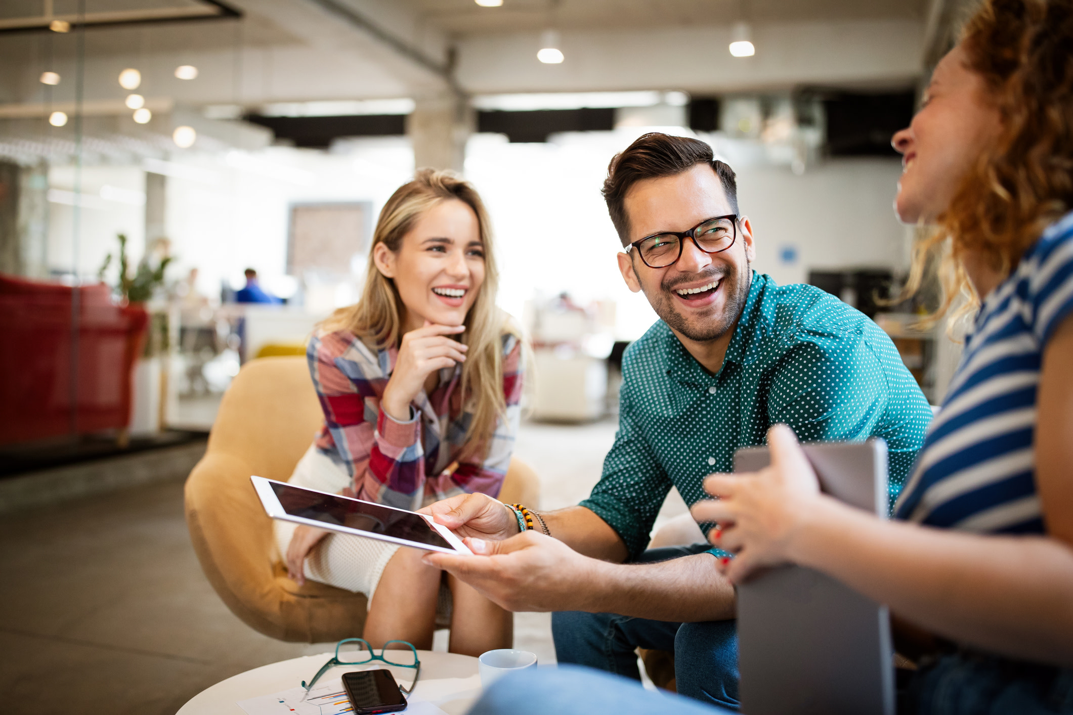 Business people, designers having fun and chatting at workplace office