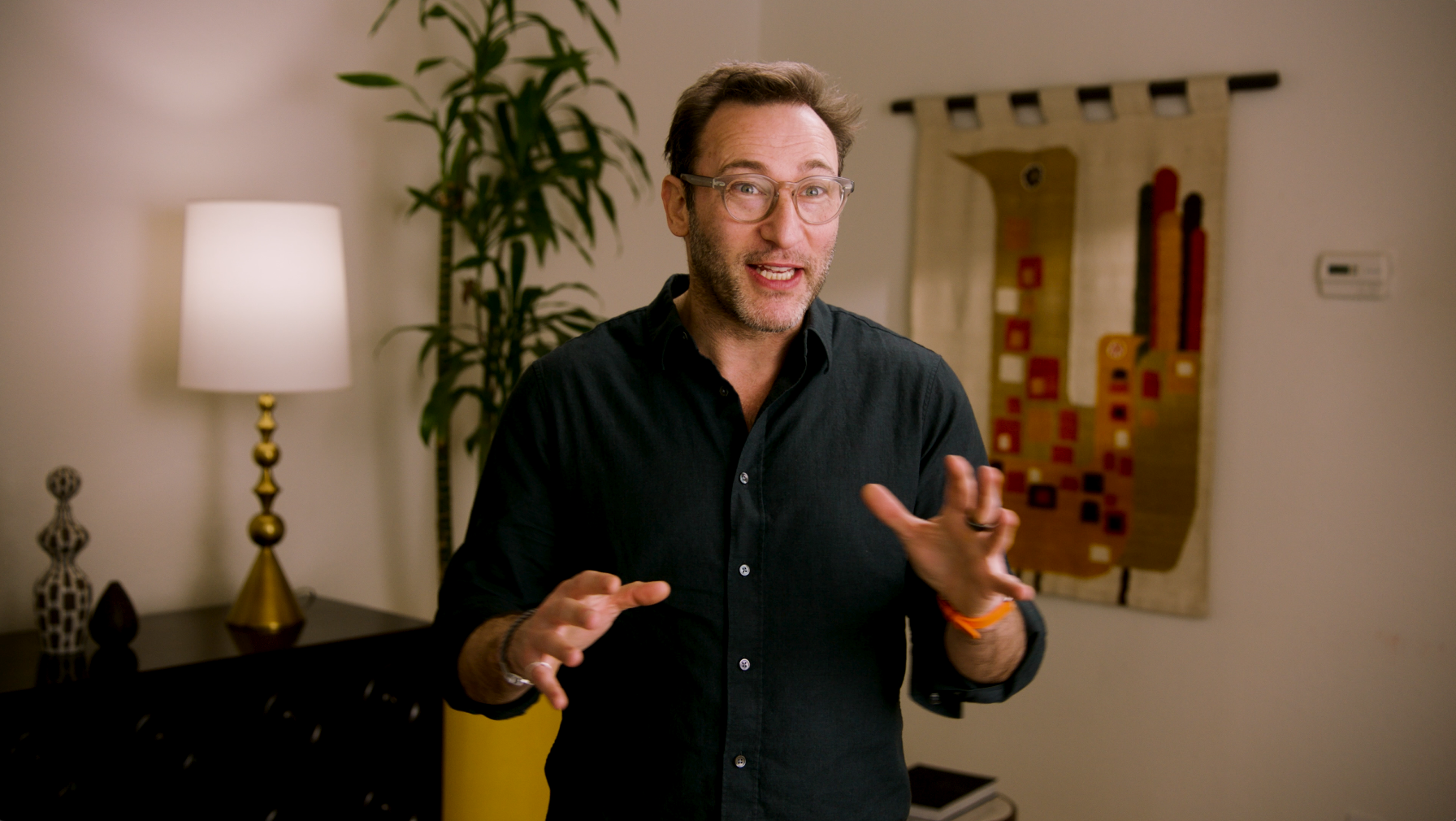 Photo of Simon Sinek speaking with quote from a teacher who was a Gift of Coaching participant: "Talking through my challenges and identifying solutions has been empowering. I feel more equipped to face obstacles moving forward."