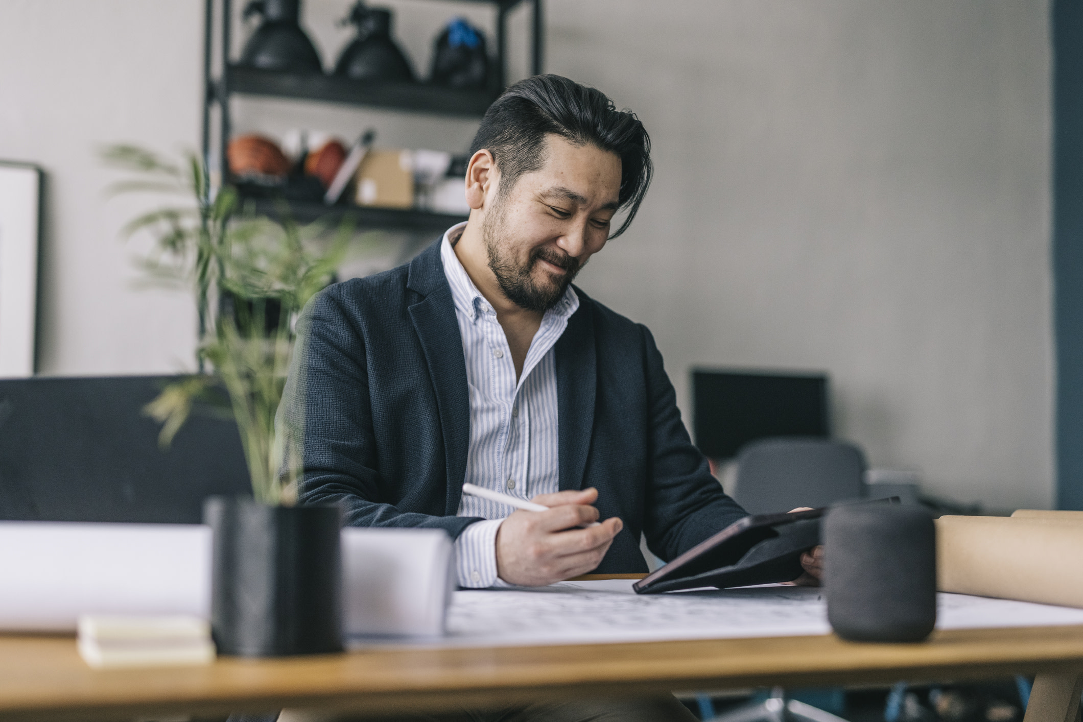 Man at a desk looking at a screen.