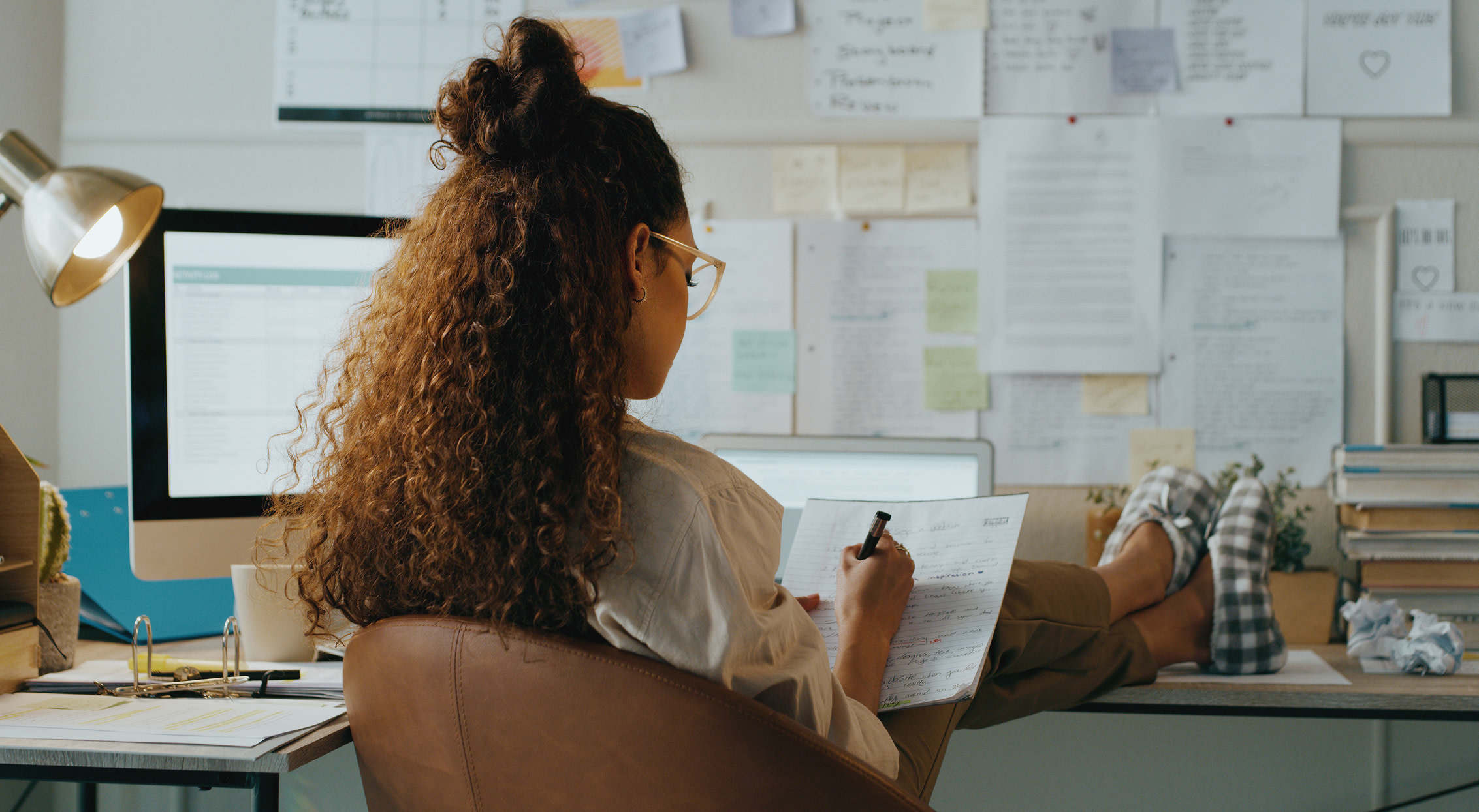 Woman taking notes.