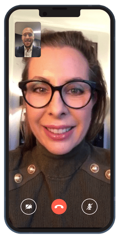 A phone showing a coaching session taking place over a video call.