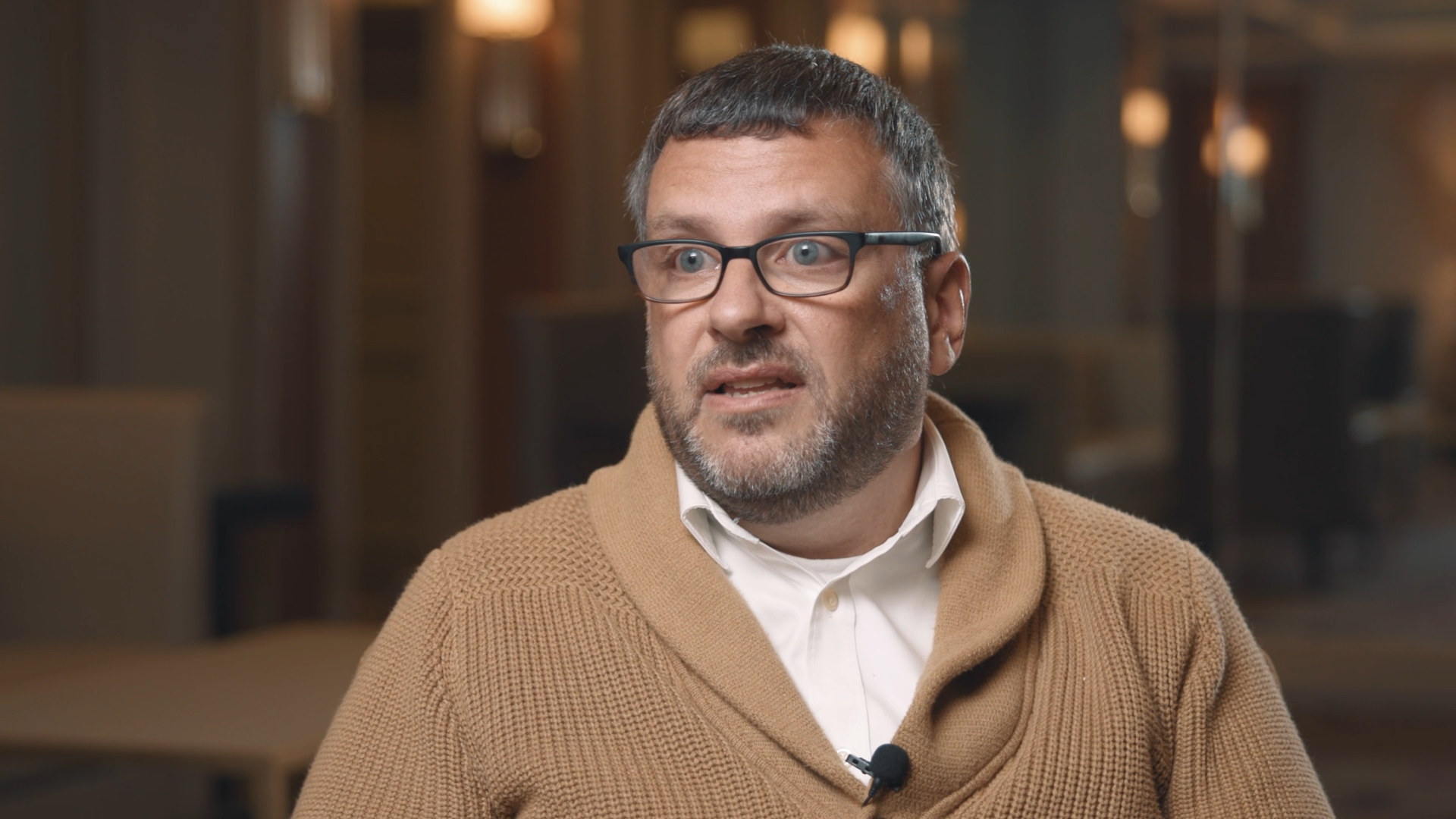 Chris Scott, Director of Talent at Nestle, wearing light brown sweater