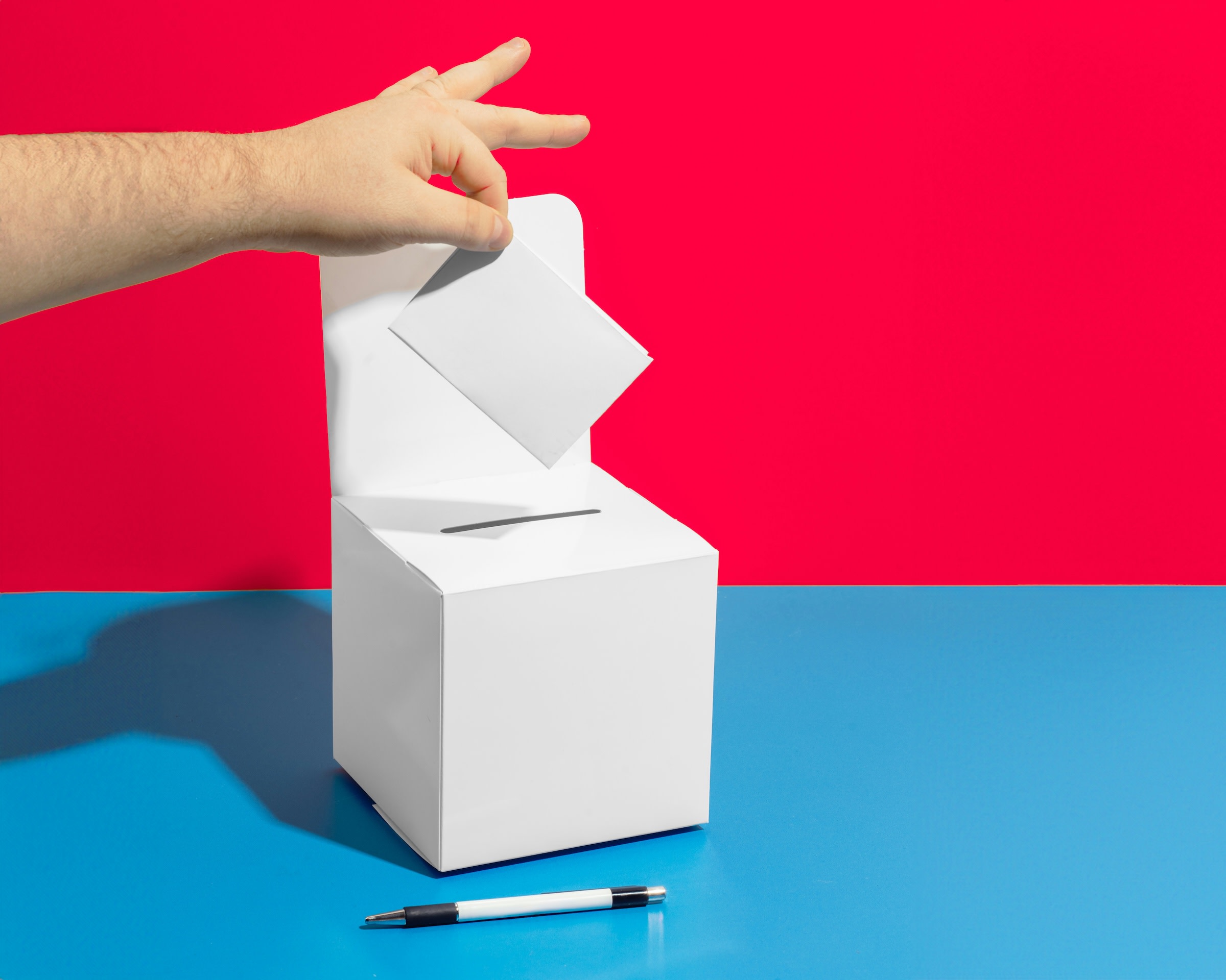 An image of a ballot box and a pen