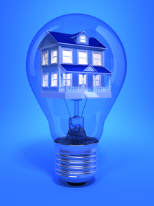 An image of a house within a lightbulb. 