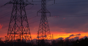 Image of electricity pylons in the sunset.