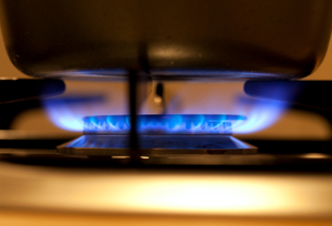 Gas stove with its flame on.