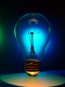 Image of a lightbulb in a dim room.
