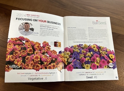 Flower catalog opened up on a wooden table
