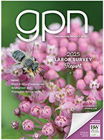 The cover of GPN magazine with a pink flower with a bee on it.