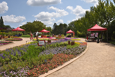 Outdoors in the Gardens at Ball with tents and colorful flowers
