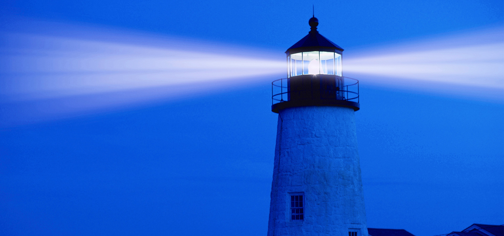 lighthouse shining a light in maine