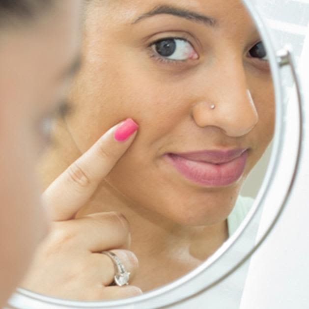 girl looking in the mirror