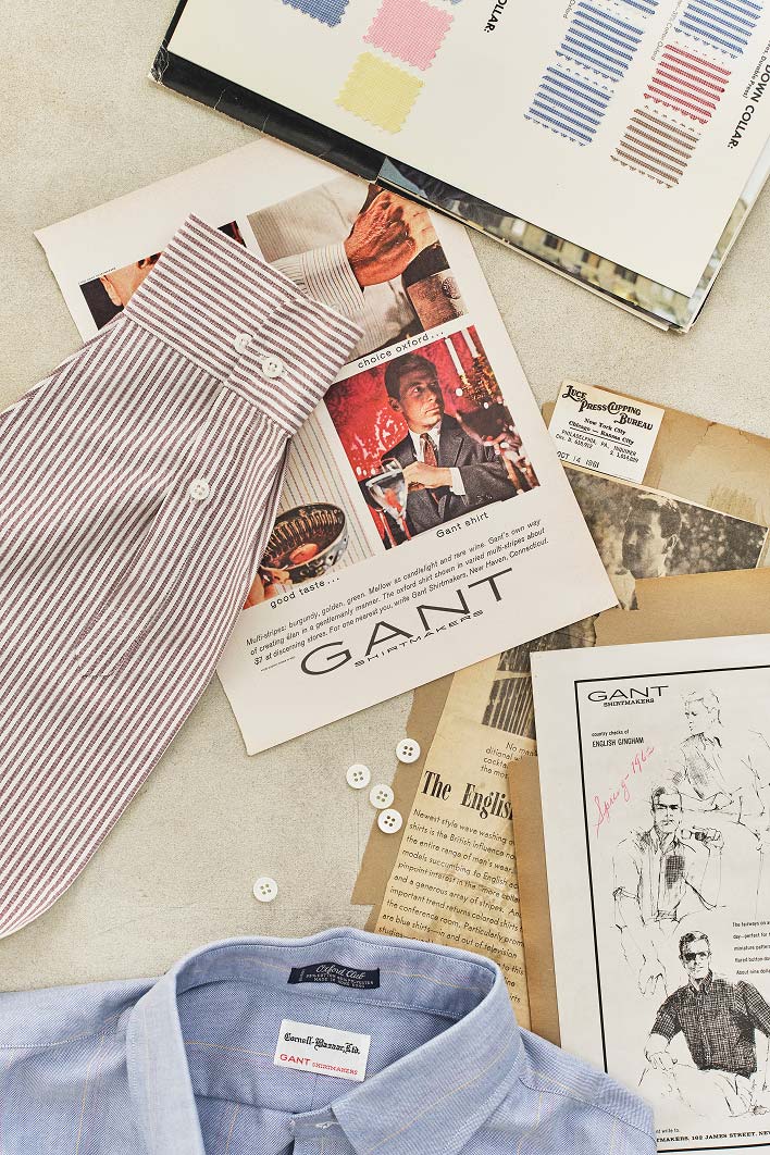 Pubblicità vintage di una camicia Gant esposta con campioni di tessuto e bottoni.