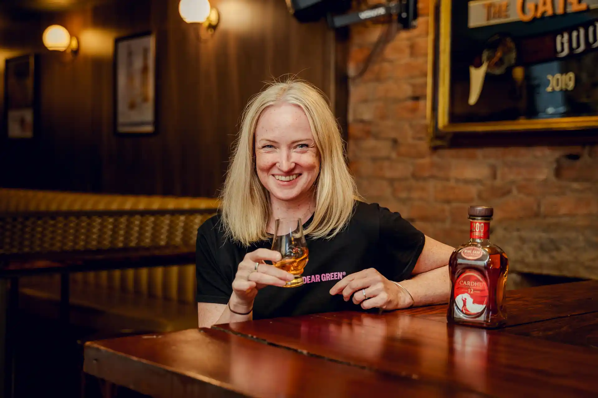 Lisa Lawson drinking Cardhu single malt scotch whisky.