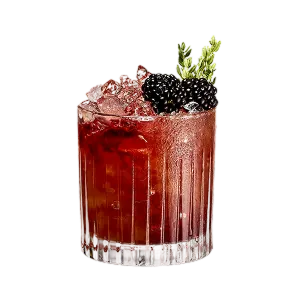 A brown-red cocktail in rocks glass with ice, two blackberries and a green herb sprig garnish
