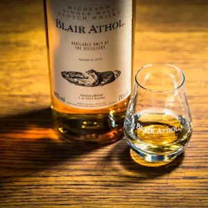 Three wooden barrels sit sideways in a row next to each other.