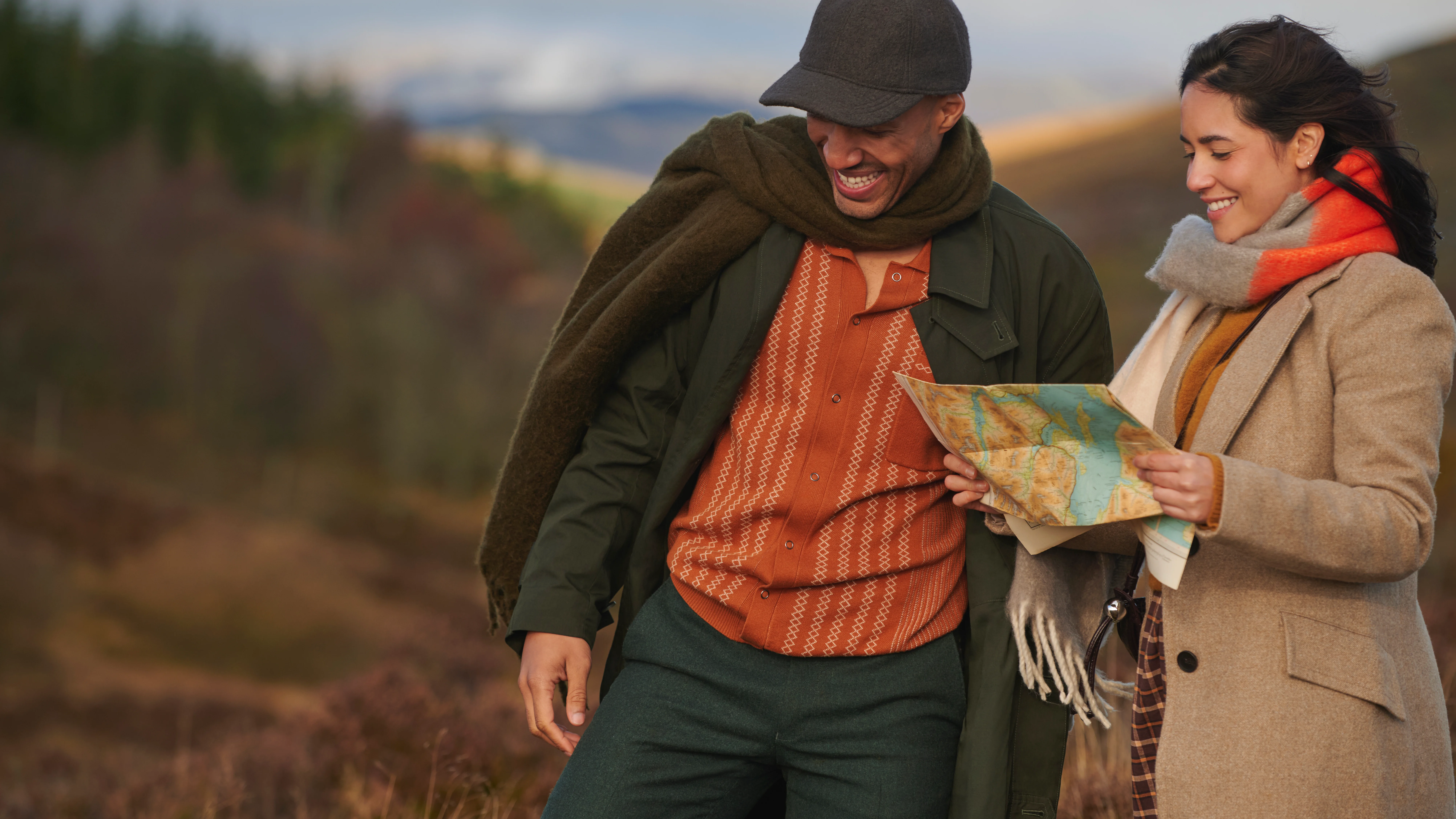Two friends lost in the Highlands, looking at a map