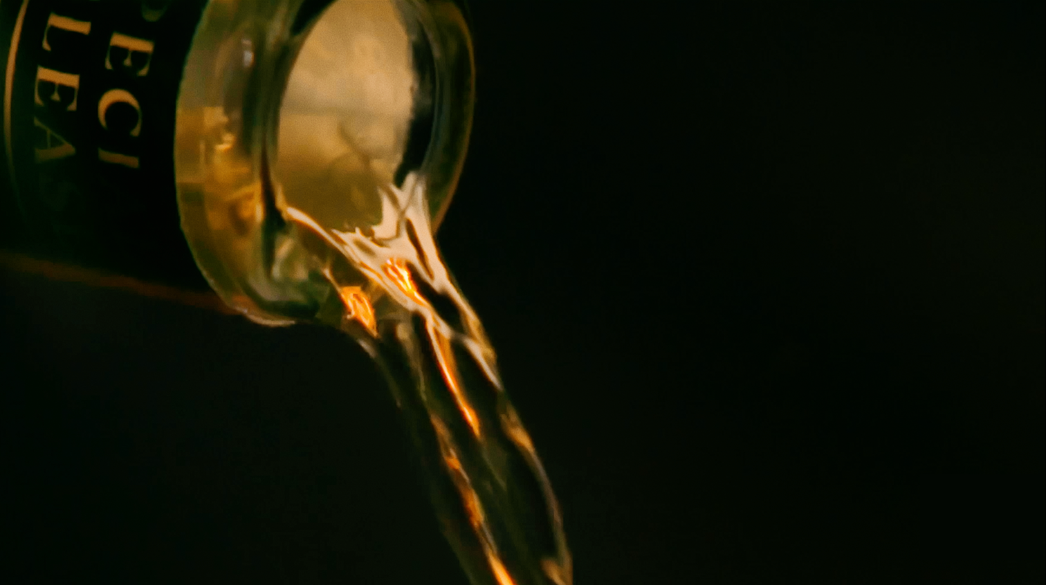 Lagavulin Grain & Embers whisky being poured from bottle