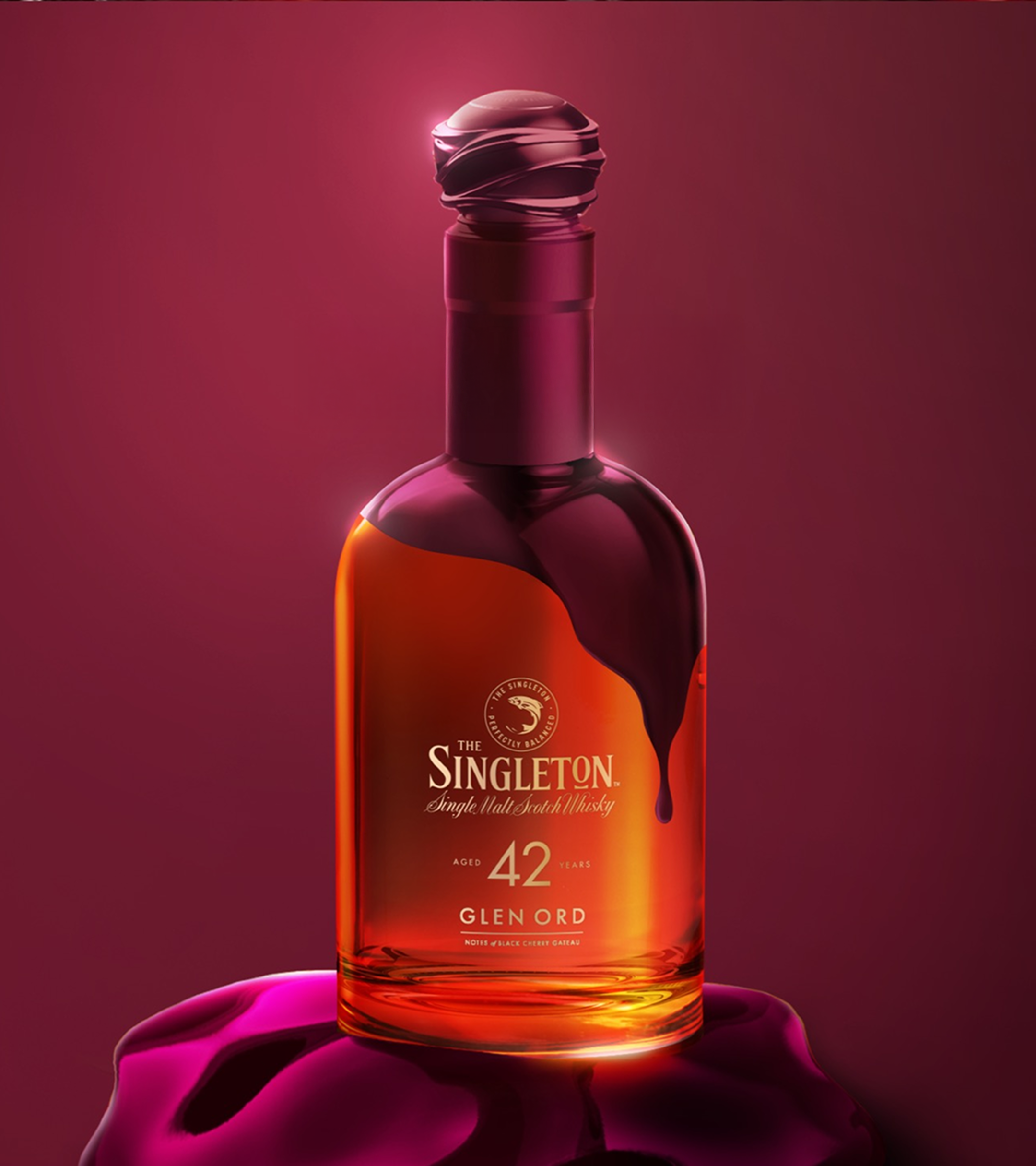  Singleton 42-Year-Old Glen Ord bottle with black cherry gâteau-inspired design on a burgundy background.