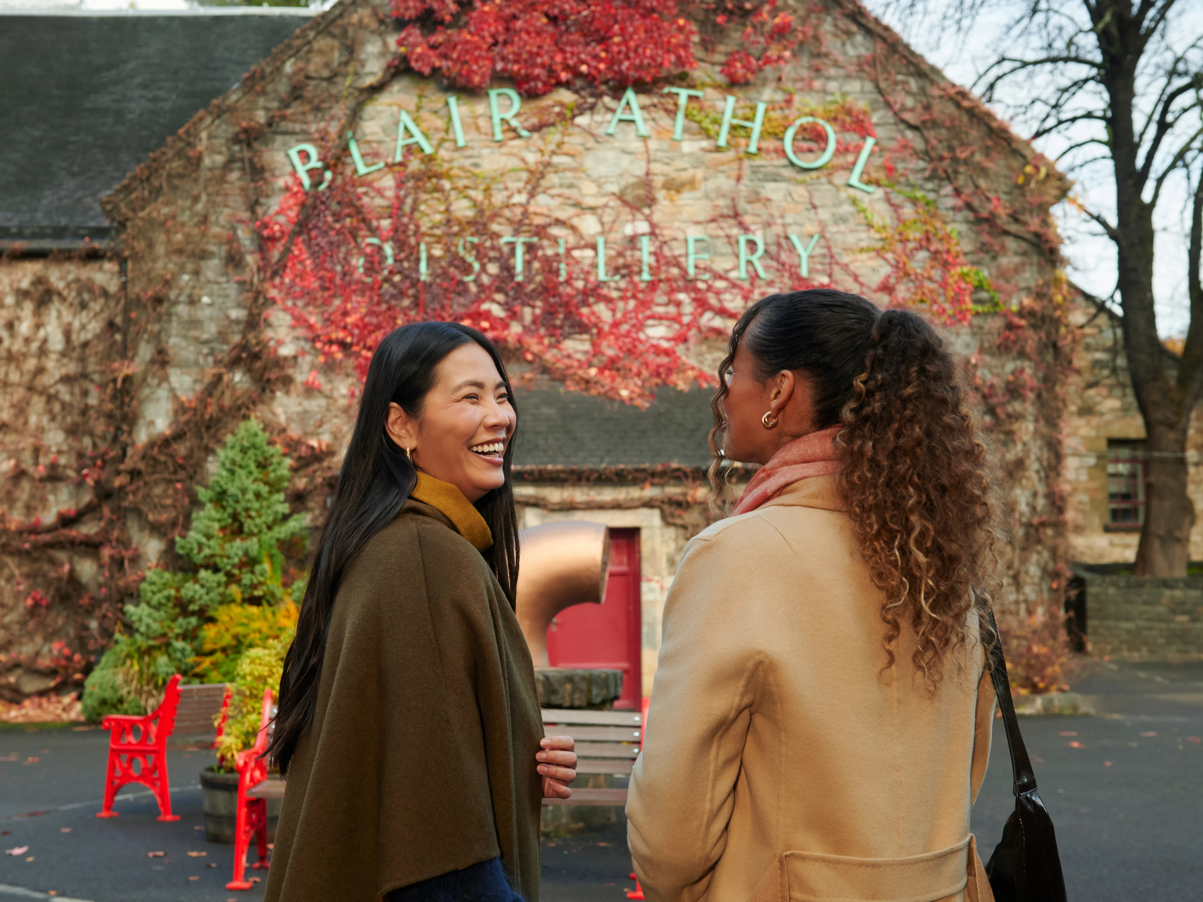 Visitors enjoying a whisky experience at Blair Athol Distillery visitor center.