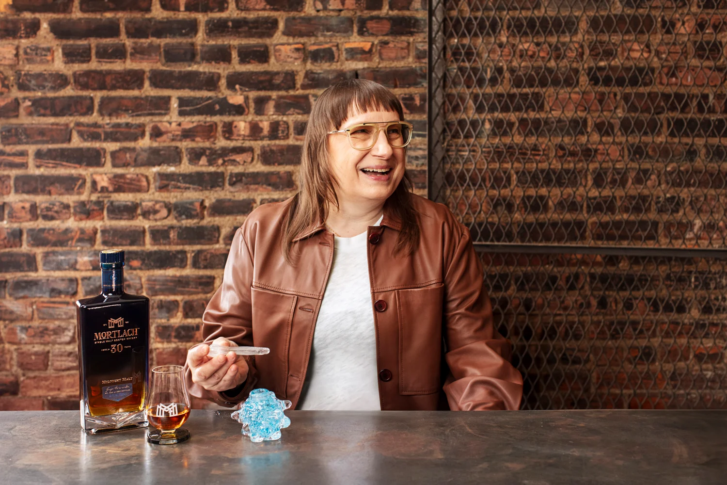 Deborah Czeresko at a table with the Morphic vessel and pipette