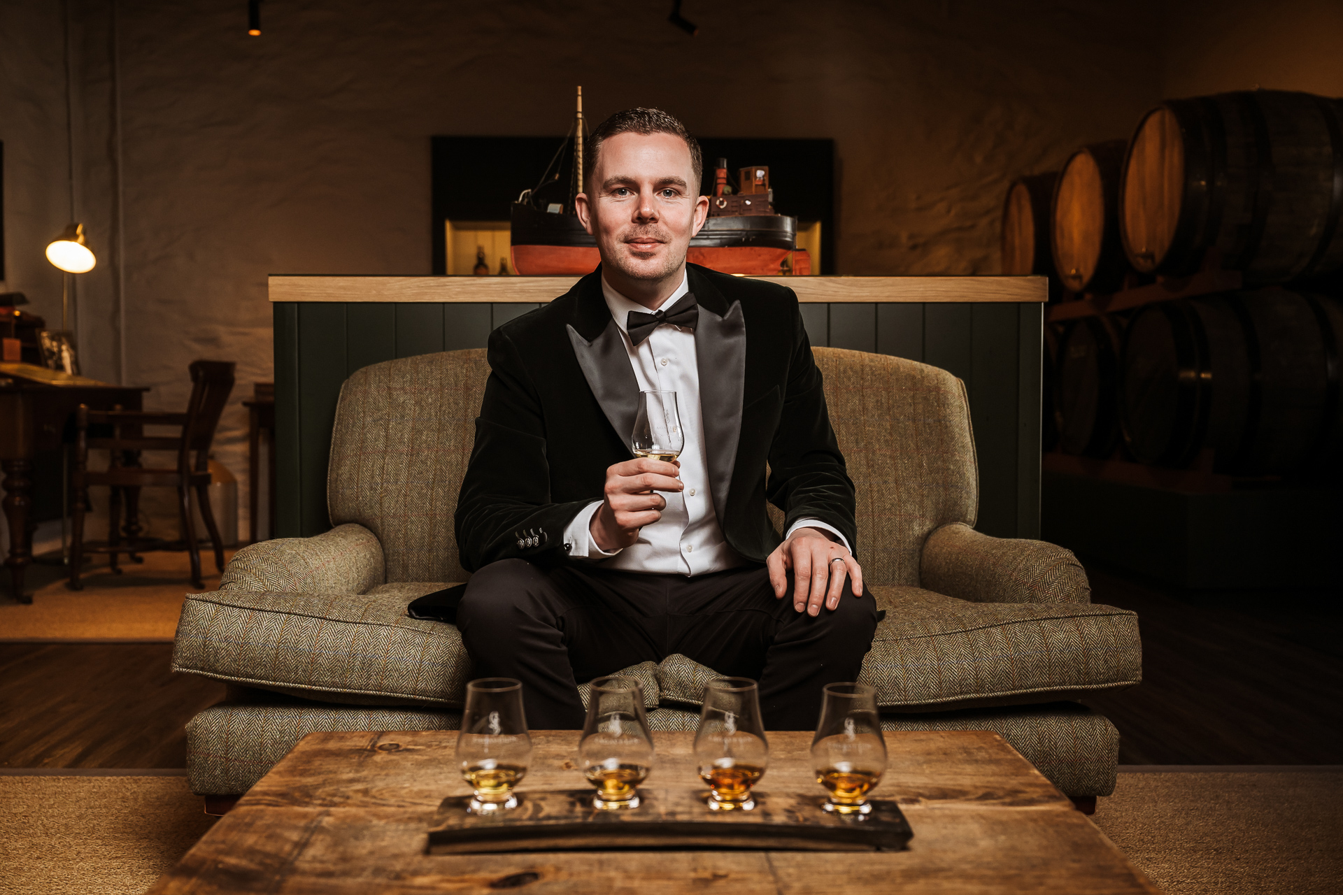 Jordan Paisley, Lagavulin Distillery Manager, sitting at the Islay distillery