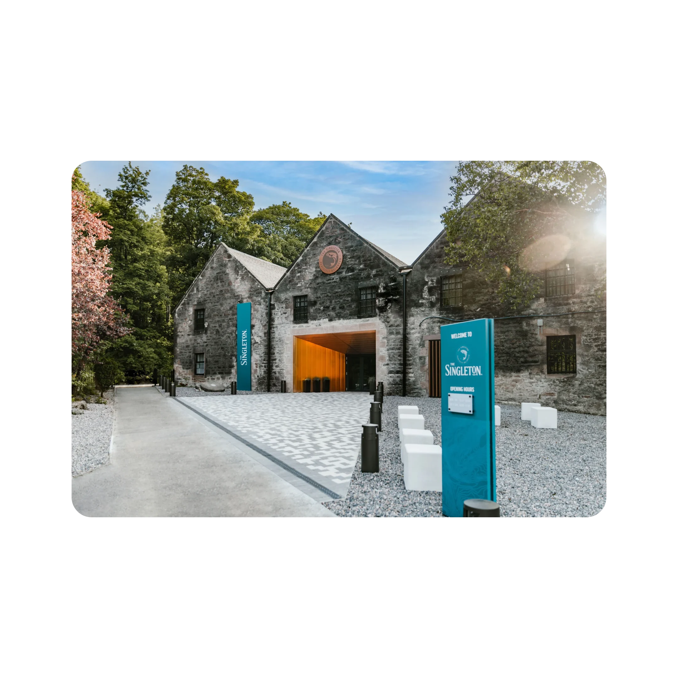 The entrance to the beautiful gray brick building home to The Singleton.