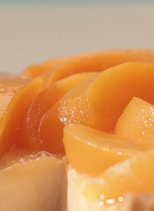 Glazed peach slices on a tart reflecting whisky’s sweet notes