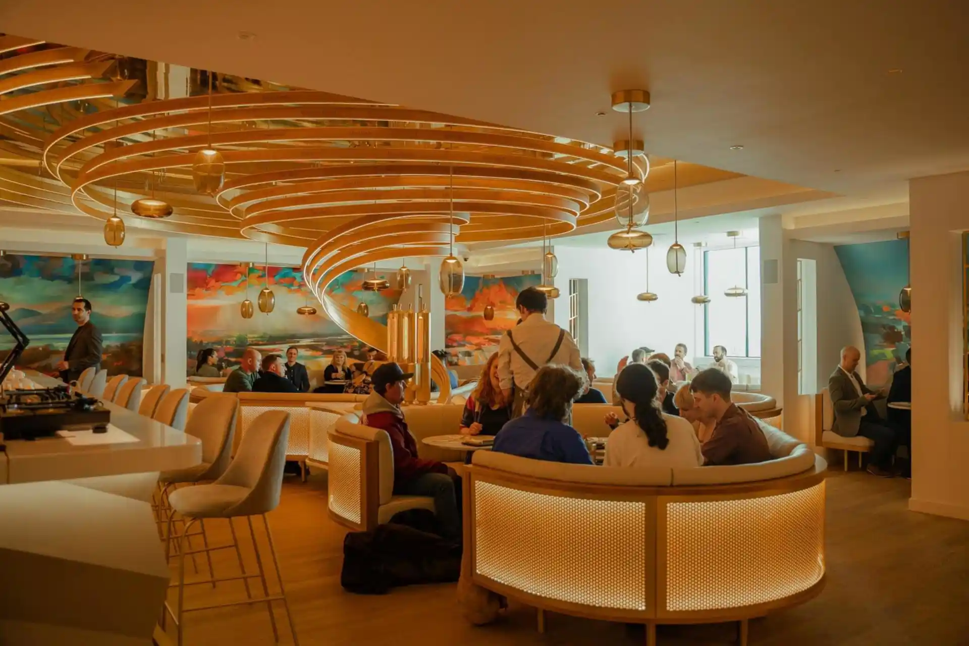 Panoramic view of the bothy's explorer bar where visitors are enjoying a tasting experience