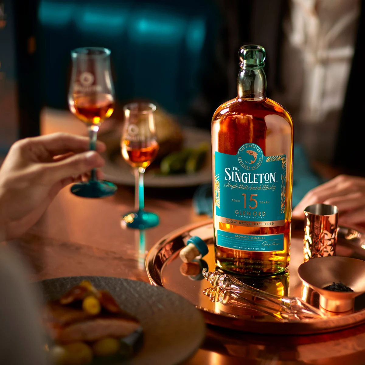 The Singleton of Glen Ord 15 Year Old Single Malt Scotch Whisky Bottle on table with 2 glasses 