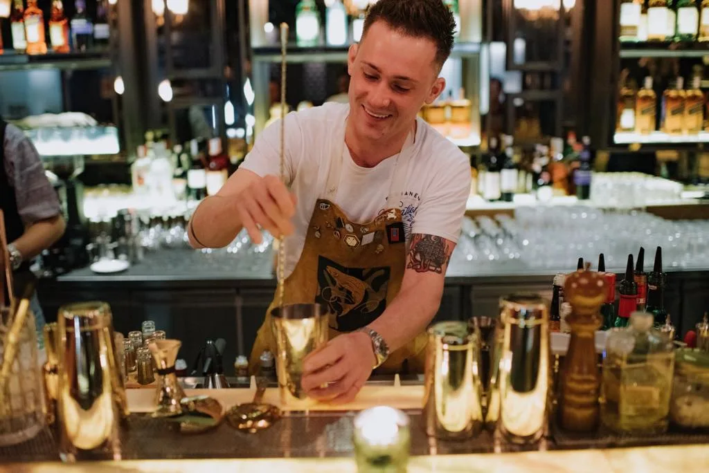 Whisky expert Ervin Trykowski tends a bar, making cocktails