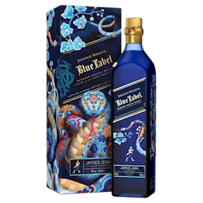 A bottle of Johnnie Walker Blue Label displayed alongside its decorative Lunar New Year gift box, featuring artwork by James Jean with floral and snake motifs.