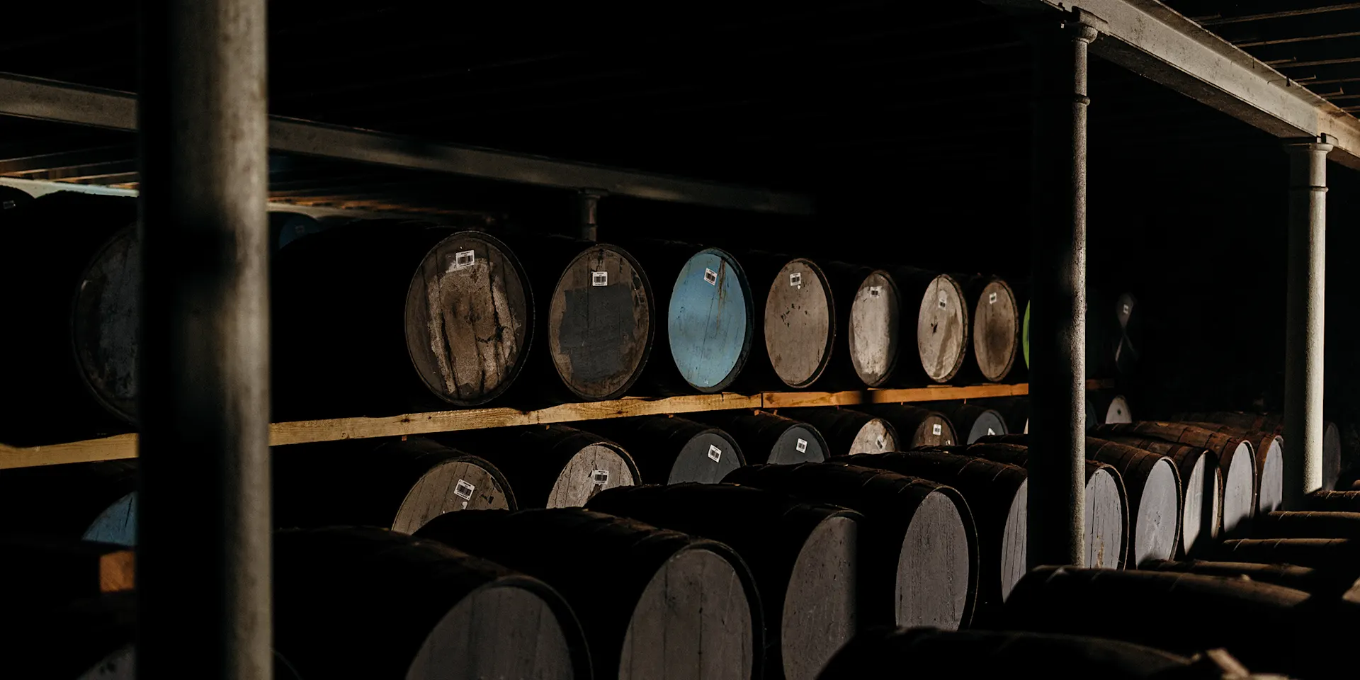 Several whisky barrels were pictured in a warehouse 