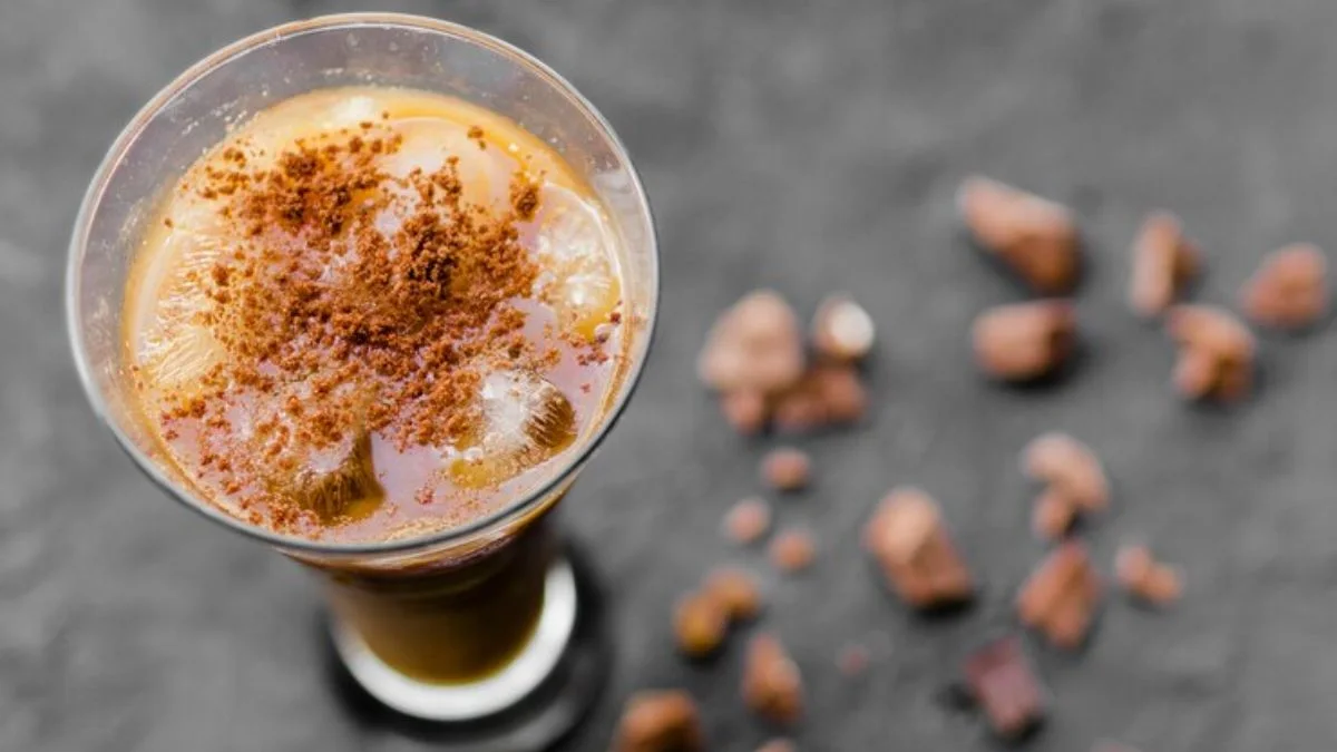 Two cocktail glasses on a wooden board