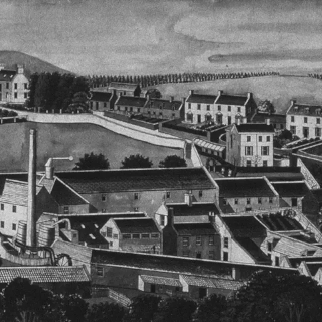 A black and white drawing of a town, featuring many buildings, a body of water, a mountain and trees.