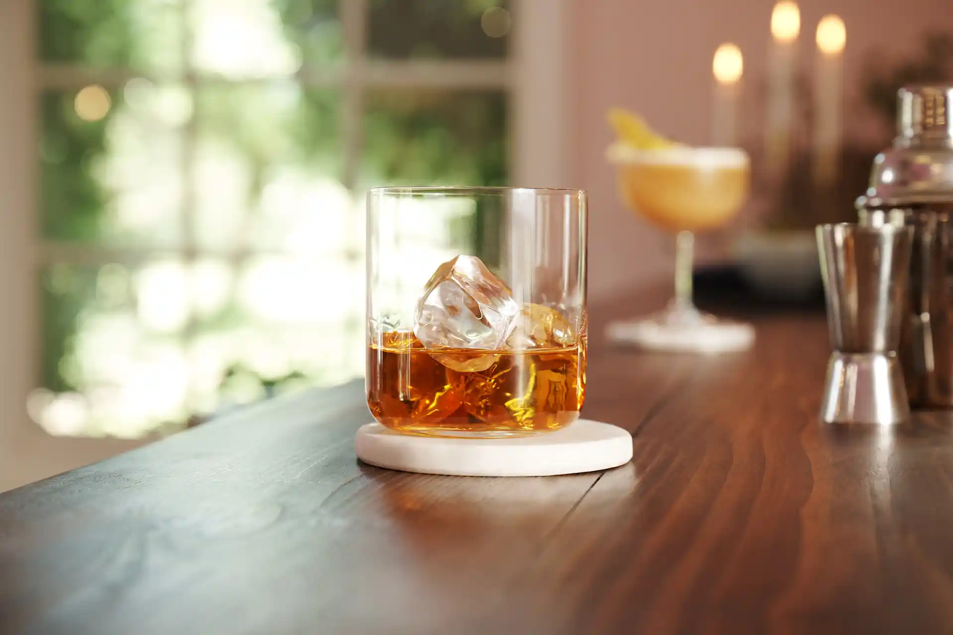 A whisky glass on a coaster