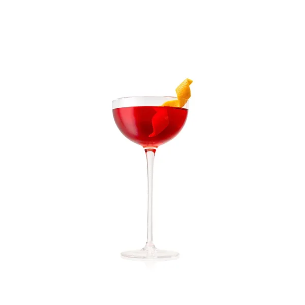 A Paper Plane cocktail in a coupe glass with a lemon peel garnish