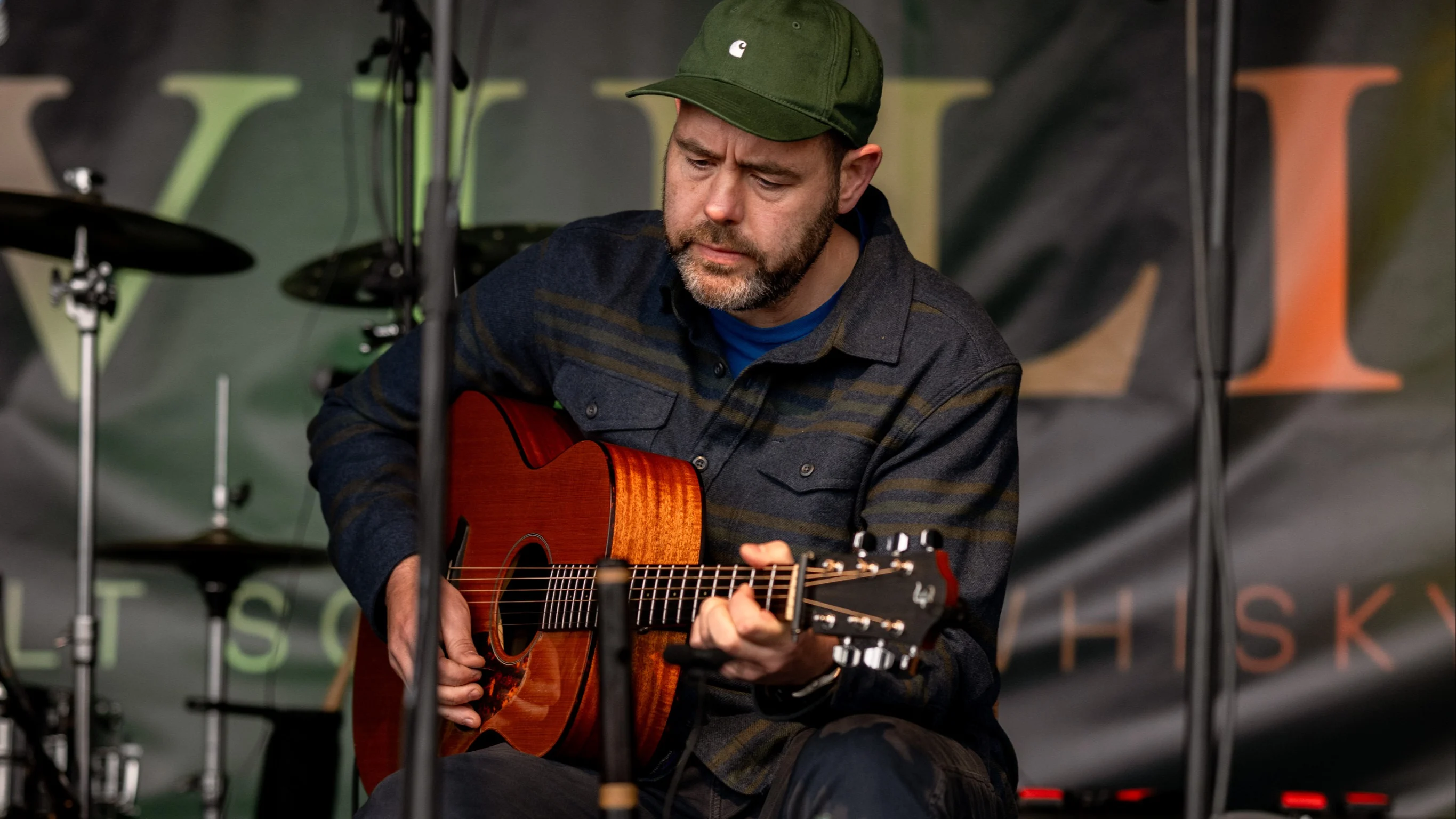 Musician performing at the Islay Festival with his guitar
